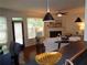 View of the living room with natural light, hardwood floors, and a decorative fireplace at 1835 Morning Star Ln, Tucker, GA 30084