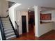Open floor plan showing staircase, kitchen and living area with hardwood floors at 1835 Morning Star Ln, Tucker, GA 30084