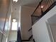 Staircase with dark railing, a window, and decorative trim at 1835 Morning Star Ln, Tucker, GA 30084