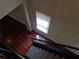 View from above on the staircase features hardwood flooring and decorative trim at 1835 Morning Star Ln, Tucker, GA 30084