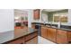 This kitchen features granite countertops and a view into the adjacent living space at 2840 Smith Ridge Trce, Peachtree Corners, GA 30071