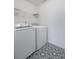 Laundry room features a modern, front loading washer and dryer at 2840 Smith Ridge Trce, Peachtree Corners, GA 30071