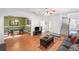 Spacious living room with hardwood floors, views of the dining area and stairway to the upper floors at 2840 Smith Ridge Trce, Peachtree Corners, GA 30071