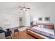 Bright primary bedroom featuring a ceiling fan, spacious layout, and wood-look flooring at 2840 Smith Ridge Trce, Peachtree Corners, GA 30071