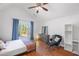 Primary bedroom with large window, ceiling fan, and plenty of natural light at 2840 Smith Ridge Trce, Peachtree Corners, GA 30071
