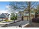 Attractive townhome complex with garages and brick accents, complemented by mature trees and landscaping at 2840 Smith Ridge Trce, Peachtree Corners, GA 30071