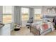 Comfortable bedroom with a gaming theme, natural light, and a cozy atmosphere at 668 Egrets Landing #64, Covington, GA 30014