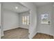 Bright entryway with luxury vinyl plank flooring and a view to the outdoors at 668 Egrets Landing #64, Covington, GA 30014