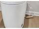Efficient white toilet features an electrical outlet and cord at 668 Egrets Landing #64, Covington, GA 30014