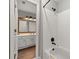 Tiled bathroom showcasing a shower and a vanity with ample storage at 1888 Fox Chapel Se Dr, Smyrna, GA 30080