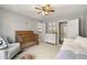 This bright bedroom showcases a crib, daybed, dresser, neutral walls, and carpet at 1888 Fox Chapel Se Dr, Smyrna, GA 30080