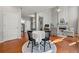 Dining area showcasing hardwood floors, fireplace, and natural light at 1888 Fox Chapel Se Dr, Smyrna, GA 30080