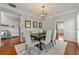 Elegant dining area with hardwood floors, modern lighting, and stylish furnishings at 1888 Fox Chapel Se Dr, Smyrna, GA 30080