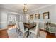 Dining room with seating for six, modern light fixture, and stylish decor at 1888 Fox Chapel Se Dr, Smyrna, GA 30080