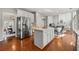 Bright kitchen with a large island, stainless steel appliances, and hardwood floors at 1888 Fox Chapel Se Dr, Smyrna, GA 30080