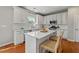 Modern kitchen featuring white cabinets, quartz countertops, stainless steel appliances, and a center island at 1888 Fox Chapel Se Dr, Smyrna, GA 30080