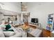 Open living room featuring hardwood floors, high ceilings, and comfortable seating arrangements at 1888 Fox Chapel Se Dr, Smyrna, GA 30080