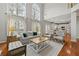 Bright living room with vaulted ceiling, open to the kitchen, and hardwood floors at 1888 Fox Chapel Se Dr, Smyrna, GA 30080