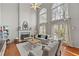 Spacious living room with vaulted ceiling, fireplace, large windows, and hardwood floors at 1888 Fox Chapel Se Dr, Smyrna, GA 30080