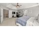 Large bedroom with vaulted ceilings, carpeted floors, and a peloton bike at 1888 Fox Chapel Se Dr, Smyrna, GA 30080