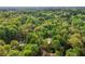 Property marker indicates location in a lush, densely wooded area; the area provides privacy and natural beauty at 230 Oakmere Dr, Alpharetta, GA 30009