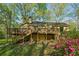 Home showcasing deck and staircase with greenery around property at 230 Oakmere Dr, Alpharetta, GA 30009