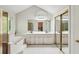 Bright bathroom with double vanity, soaking tub, and glass shower at 230 Oakmere Dr, Alpharetta, GA 30009