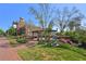 Exterior view of the building with beautiful landscaping, walkways, and garden area at 230 Oakmere Dr, Alpharetta, GA 30009
