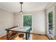 Cozy dining area with hardwood floors, natural light and deck access at 230 Oakmere Dr, Alpharetta, GA 30009