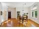 Hardwood floors leading to the entryway and dining area bathed in sunlight at 230 Oakmere Dr, Alpharetta, GA 30009
