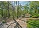 Charming single-Gathering home with attached garage on a wooded lot at 230 Oakmere Dr, Alpharetta, GA 30009