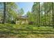 Exterior side view of home with a deck and natural surroundings at 230 Oakmere Dr, Alpharetta, GA 30009