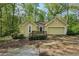 Charming single-story home featuring a well-maintained front yard and attached garage at 230 Oakmere Dr, Alpharetta, GA 30009