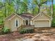 Charming home with a one-car garage, well-maintained landscaping, and inviting curb appeal at 230 Oakmere Dr, Alpharetta, GA 30009