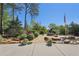 Outdoor space with lush landscaping, including a pond and patriotic monument at 230 Oakmere Dr, Alpharetta, GA 30009