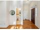 Hallway with hardwood floors leading to a half bathroom at 230 Oakmere Dr, Alpharetta, GA 30009