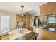 Bright kitchen features custom cabinets, stainless steel appliances, built-in desk and breakfast table at 230 Oakmere Dr, Alpharetta, GA 30009