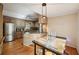Kitchen offers stainless steel appliances, hardwood floors, and breakfast table at 230 Oakmere Dr, Alpharetta, GA 30009