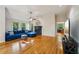 Sun-filled living room showcasing hardwood floors and comfortable seating at 230 Oakmere Dr, Alpharetta, GA 30009