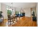 Bright living room featuring hardwood floors, a fireplace, and large windows at 230 Oakmere Dr, Alpharetta, GA 30009