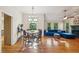 Open concept living space with a dining area, hardwood floors, and plenty of natural light at 230 Oakmere Dr, Alpharetta, GA 30009