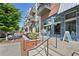Charming street view featuring retail storefronts and residential units with elegant balconies at 230 Oakmere Dr, Alpharetta, GA 30009