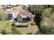 The backyard features a screened in porch, a patio, and a lush green lawn at 5095 Hamby Hollow Ln, Cumming, GA 30028