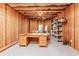 Unfinished basement with wooden walls and a desk at 5095 Hamby Hollow Ln, Cumming, GA 30028