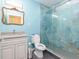 Stylish bathroom with a glass-enclosed shower, modern vanity, and attractive blue walls at 5095 Hamby Hollow Ln, Cumming, GA 30028