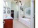 Bright bathroom features a soaking tub, dual sinks, and decorative window at 5095 Hamby Hollow Ln, Cumming, GA 30028