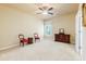 Spacious bedroom featuring neutral tones, a ceiling fan, and a bright window at 5095 Hamby Hollow Ln, Cumming, GA 30028