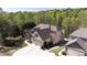 Stunning home with a two-car garage, manicured lawn, and inviting landscaping at 5095 Hamby Hollow Ln, Cumming, GA 30028
