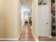 Inviting hallway with hardwood floors and views of the home's open layout at 5095 Hamby Hollow Ln, Cumming, GA 30028
