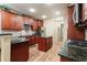 Gourmet kitchen featuring granite countertops, stainless steel appliances, and custom wood cabinetry at 5095 Hamby Hollow Ln, Cumming, GA 30028